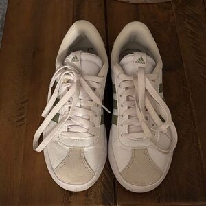 Green and white adidas women’s sneakers